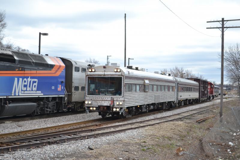 The CP Geometry train (left) sits next to Metra locomotive 426 as it waits to begin its trip south from Fox Lake. (Photo by Edward A. Oom/CP)